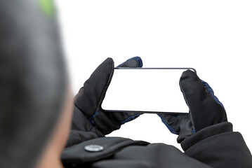 Man holding a mobile phone in a horizontal position. Isolated display and background. Concept intended for presentation of apps, use of mobile maps, playing games on mobile platforms