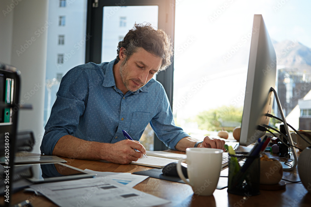Poster notebook, writing and planning with a businessman working on his desk in the office for growth or de