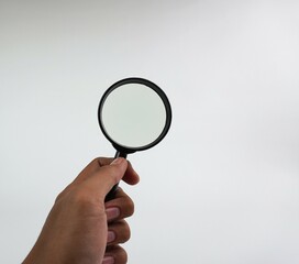 Magnifying Glass on White Background. Creativity Concept Photography.

