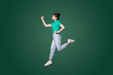 Fototapeta na wymiar Full size profile photo of attractive woman runaway wanting to come first in the morning isolated green color background.
