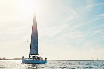 Sea, yacht and sailing on the ocean on vacation by summer sunshine on water. Lens flare, holiday...