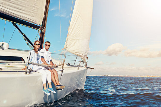 Vacation, Ocean And Portrait Of A Couple On A Yacht For Adventure, Freedom And Sailing Trip. Travel, Summer And Mature Man And Woman On A Boat In The Sea For A Romantic Seaside Holiday In Greece.