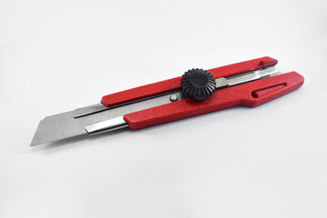 Red cutter knife isolated on white background