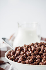 sweet crunchy chocolate children's breakfast chocolate balls on a white background