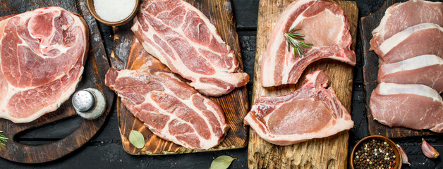 Different kinds of pork meat with spices.