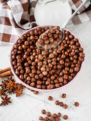 sweet crunchy chocolate children's breakfast chocolate balls on a white background
