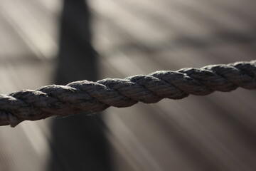 a sea rope stretched in a line against the background of lines going to the horizon © Inna Italy