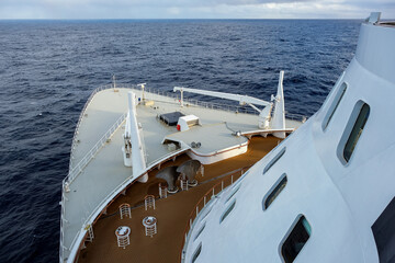 View from deck over bow and side of legendary luxury ocean liner cruise ship on passage during...