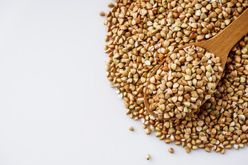 organic raw green buckwheat on a white background