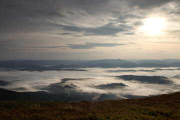 Naklejka na ściany i meble Foggy valley in the morning near Borzhava ridge, Ukrainian Carpathians