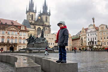 Child in Prague, eating traditional czech dessert trdelnik