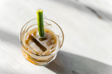 Frapuccino in a cafe in Bali. Cold coffee drink with an organic straw.