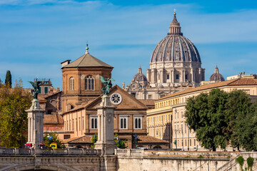 Fototapeta na wymiar St. Peter's basilica dome in Vatican seen from Tiber river embankment, Rome, Italy