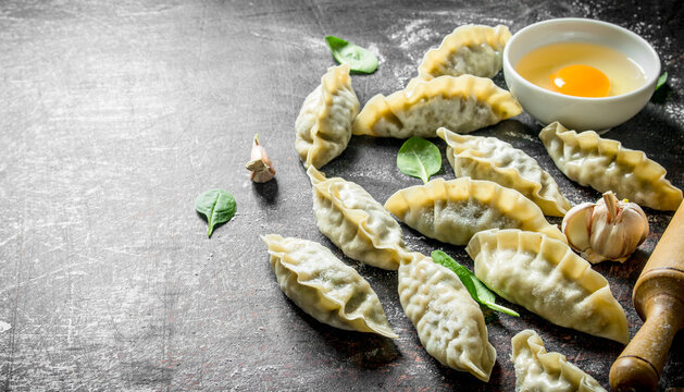 Preparation raw gedza dumplings.