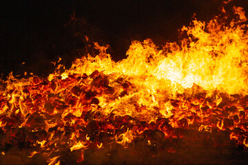 Fototapeta na wymiar Fire by night. Flames and embers. Hot and inferno
