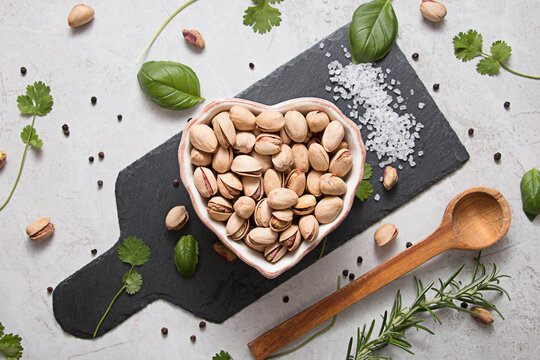 Pistacio nuts in heart shaped bowl