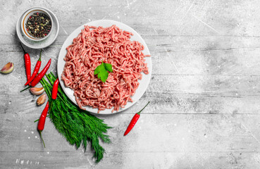 Raw minced meat with spices and herbs .