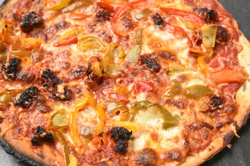 Italian pizza top view close up on slate background