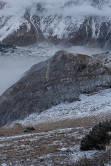 Georgian mountains. Kazbegi. Snow hills, epic clouds