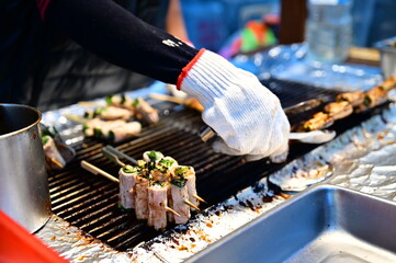 Yilan, Taiwan - Dec 24, 2022:  A shot of scallion pork rolls kebab stall in Luodong night market.