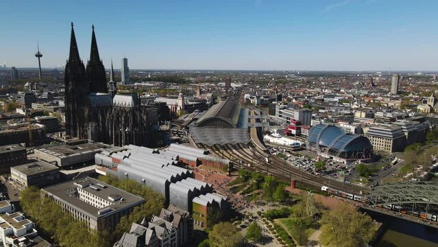 Aerial slide display Cologne Central Station amidst Cathedral Germany
