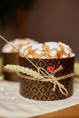 Easter cake with rustic decoration, wheat on wooden table the holiday