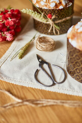 Easter cake with rustic decoration, wheat on wooden table the holiday