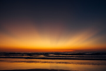 Fototapeta na wymiar Colorful twilight over the sea. Stunning sunset on the ocean coast. Evening sky.