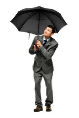 A young businessman holding his umbrella isolated on a PNG background. © peopleimages.com