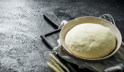 The dough on a cutting Board with spikes.