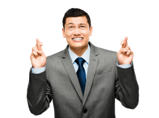 A young businessman crossing his fingers isolated on a PNG background.