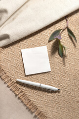 Neutral beige background with blank paper card sheet with empty mock up copy space. Aesthetic...