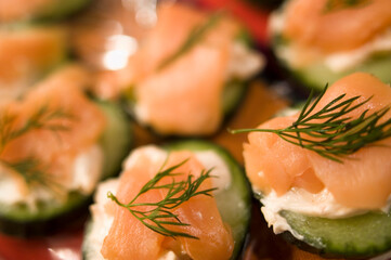 Salmon, cream cheese, and dill on a cucumber make an easy and scrumptious hors d'oeuvres. (close up)
