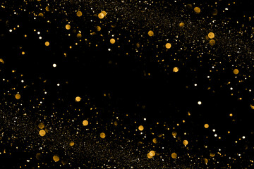 Fototapeta na wymiar Gold bokeh and shinhing particles on black backound for magic design.