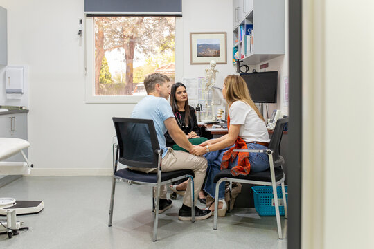 Female doctor doing consultation with her patients in the clinic