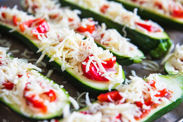 before baked zucchini with ham and vegetables, under cheese