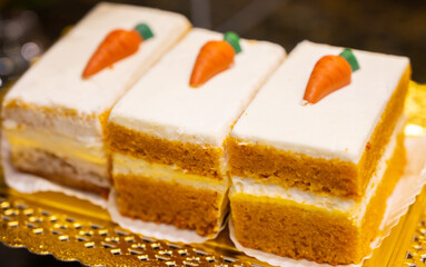 Delicious fresh baked colorful decorated cakes, tarts with cream and fruits on display in bakery in Bilbao, Basque Country, Spain