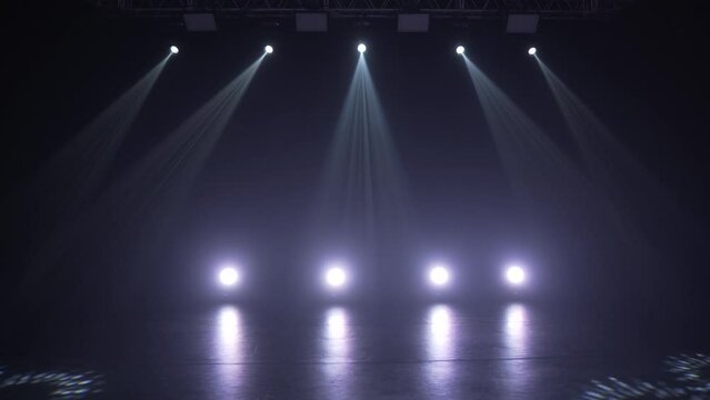 Stage lighting in the studio. Professional concert light on stage. Prerequisites for various projects. Lighting equipment in a nightclub. The concept of nightlife, music, entertainment and technology.