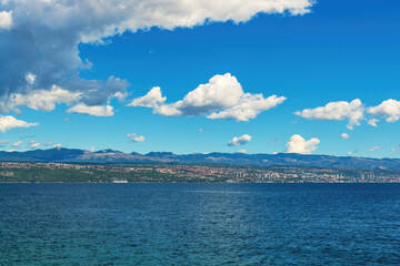 Fototapeta na wymiar Town of Rijeka on Croatian Adriatic sea coastline seen from the Kvarner gulf shoreline and town of Lovran