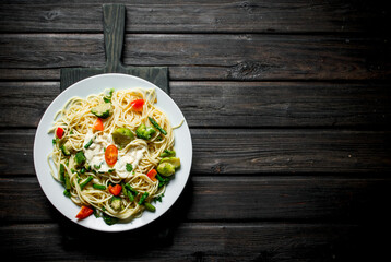 Pasta with Brussels sprouts,broccoli and tomatoes.