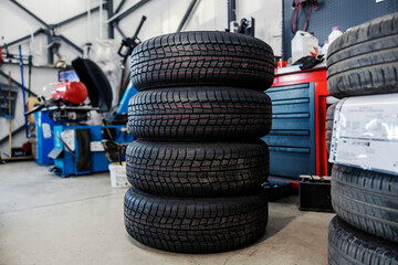 Picture of new tires ready for changing. - Powered by Adobe