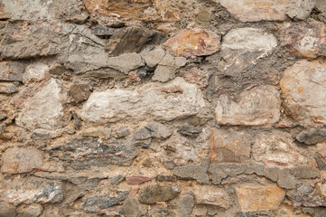 Grunge wall background with old stones texture