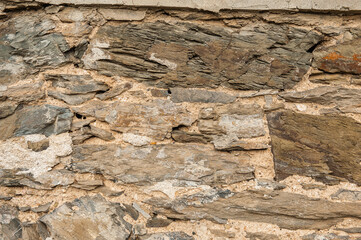 Grunge wall background with old stones texture