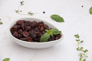 Sundried cranberries in white bowl
