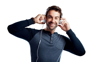 A handsome young man using headphones isolated on a PNG background.