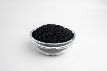 Nigella sativa Plant, black sativa in a glass dish on a white background