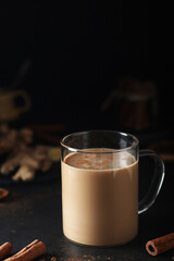 A cup with masala chai in low key