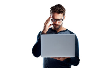 A handsome young man using a laptop and looking stressed isolated on a PNG background.
