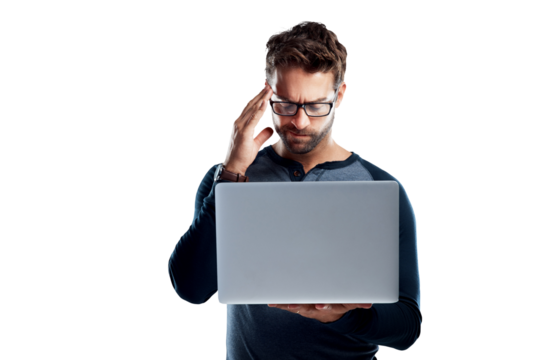 A handsome young man using a laptop and looking stressed isolated on a PNG background. - Powered by Adobe