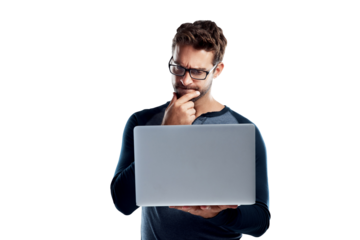 A handsome young man using a laptop and looking confused isolated on a PNG background.